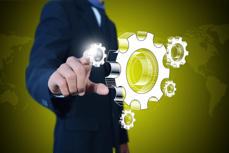 businessman showing gears cogs to success concept
