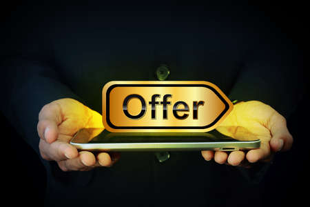 Smart hand showing sale tagの写真素材