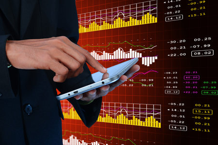 Business man calculating the digital tablet