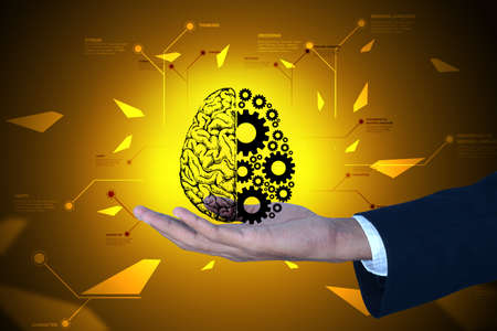 Man showing brain and gear wheels in color back groundの写真素材