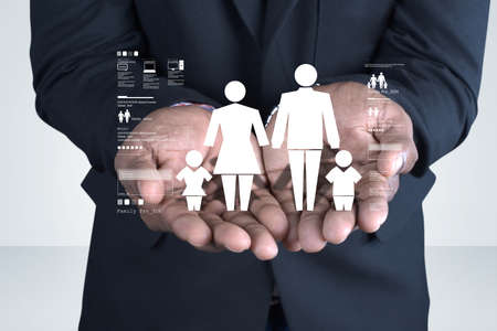 Family icon in the hands of manの写真素材