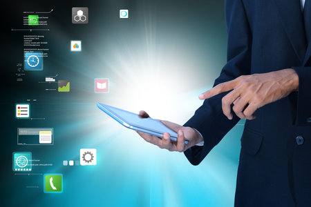 male executive using digital tablet