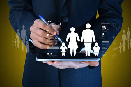 Family icon in the hands of manの写真素材