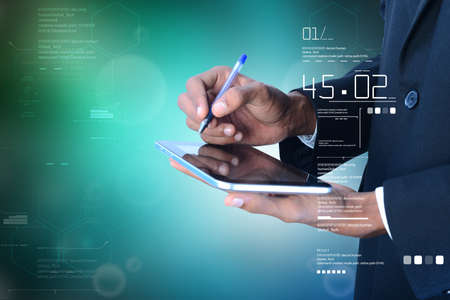 Business man writing on the digital tabletの写真素材