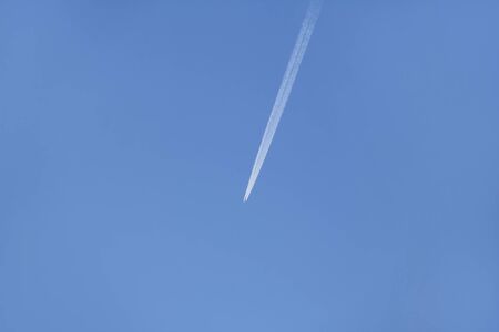 Flight of the plane in the blue sky.の写真素材