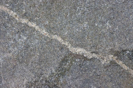 Surface texture of gray torn granite stone.の写真素材
