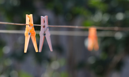 Clips on the rope for drying the laundry after washing.