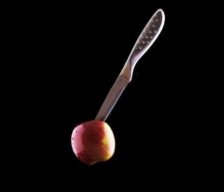 Cutting into an Apple before eating it.の写真素材