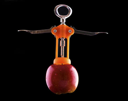 Corkskrew removing apple coreの写真素材