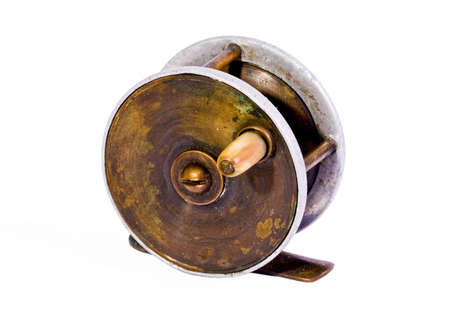 Antique Fishing Reel on a white backgroundの写真素材