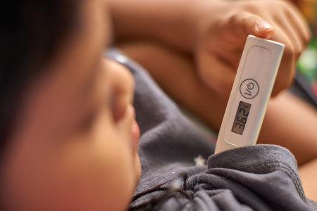 close-up of asian girl check their own temperature. healthy concept stock photo.