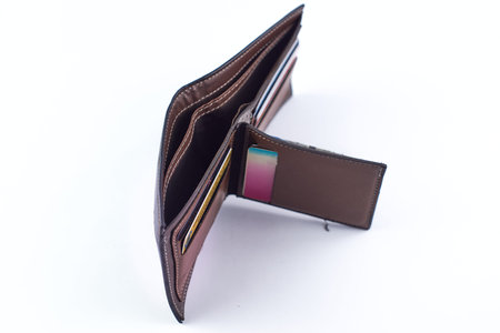 Leather wallet on a white background. The concept of money and savings