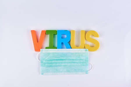 Health, safety and pandemic concept, virus alphabets color sign paired with medical mask for campaign pretection from virus disease.の写真素材