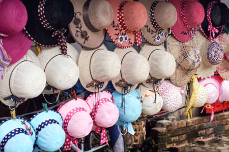 Straw hats for sale in the street market in Chiang Mai, Thailandの写真素材