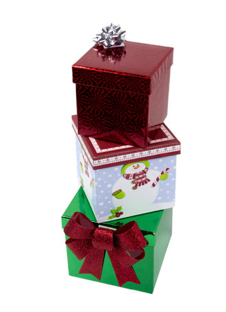 Boxed and decorated Christmas presents isolated on white background