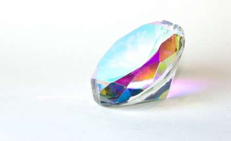 Faceted round cut mystic topaz gemstone on white backgroundの写真素材