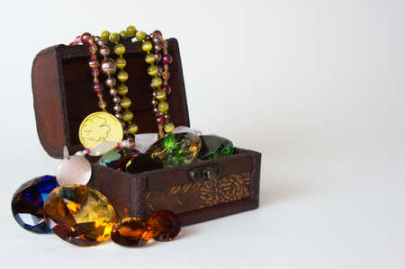 Pirate treasure chest with jewelry   gemstones on white backgroundの写真素材