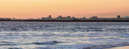 Long Beach cityscape and ocean at sunsetの写真素材