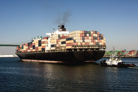 Huge container ship under the historic Vincent Thomas Bridge in San Pedro (Port of Los Angeles)