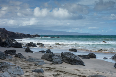 Rocky Maui shoreline with slow moving waves