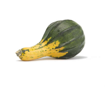 Green and yellow squash isolated on white background with light shadowの写真素材