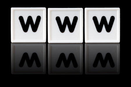 WWW spelled in game letters reflected on isolated black background