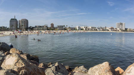 People enjoying the beach at Long Beach, Californiaの写真素材