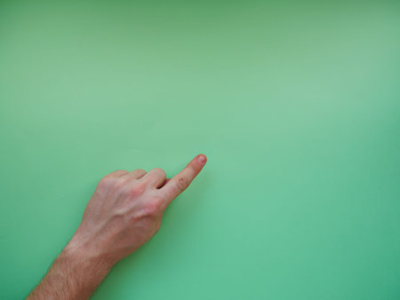 Young woman showing gesture on color background. Space for text. top view