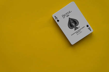 Poland, April 2020. A deck of Bicycle cards fanned out on an isolated background.のeditorial素材