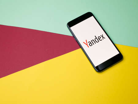 USA - May, 2020; Yandex Iphone Application Screen on colored paper background.のeditorial素材