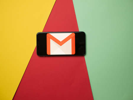 USA - May, 2020; Gmail Iphone Application Screen on colored paper background. #Gmailのeditorial素材