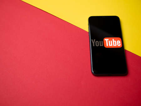 USA - May, 2020; YouTube Iphone Application Screen on colored background.のeditorial素材