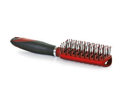 Red Hair Brush on White Background の写真素材