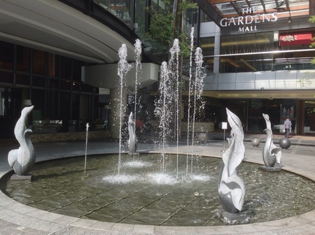 Water fountains in front of The Gardens Mallの素材