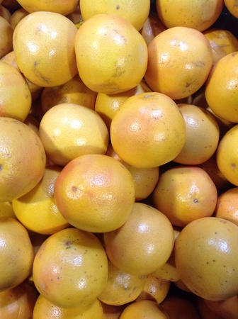 Fresh grapefruits for sale at supermarketの素材