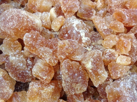 Brown rock sugars for sale at supermarket の素材