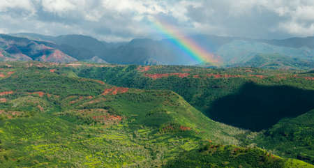 rainbow over waimea canyon area kauai hawaiiの写真素材