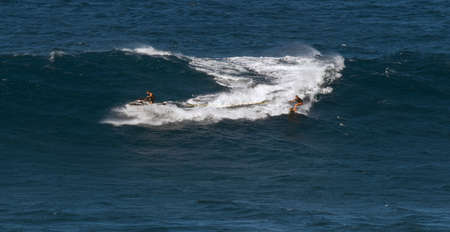 MAUI, HAWAII, USA - DECEMBER 15, 2013: towing a surfer into a big wave at jawsのeditorial素材