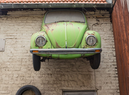 FRANKFURT, HESSEN, GERMANY-OCTOBER 29, 2012: front of a vw beetle at the wall of a garage