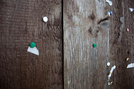 Wooden wall with thumbtacksの写真素材