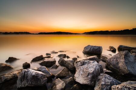 Rocky shoreline at Blue Marsh Lake just before daybreakの写真素材