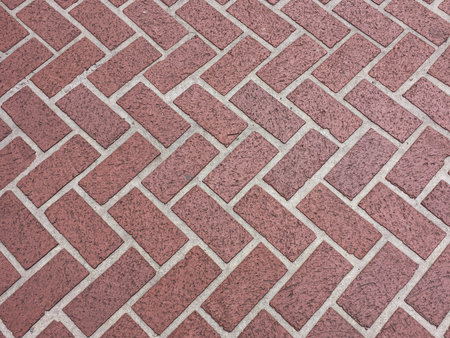 Red brick pavers forming a pattern to use as a background