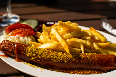Currywurst with french fries and sauceの写真素材