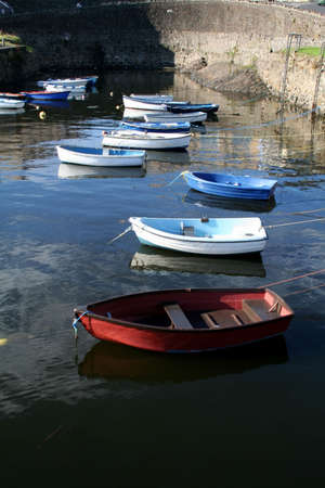 Rowboats sitting in the harbour waiting to go fishingの写真素材