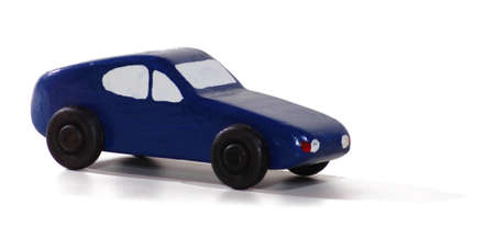 A wooden toy car isolated on whiteの写真素材