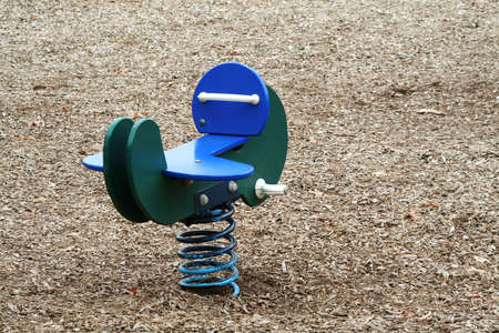 A spring toy airplane in a parkの写真素材