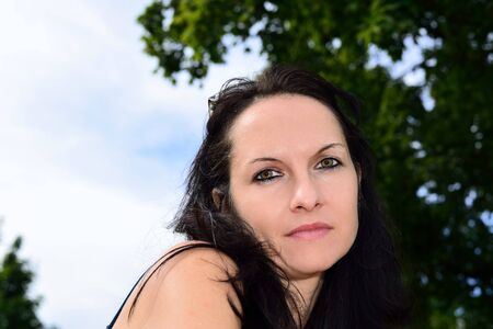 Young woman posing in the sunの写真素材