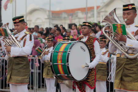 A member of military army band wears tiger skin's tippet as he performs during a Malaysia's national day celebration near Ipoh railway station, Perak state.のeditorial素材