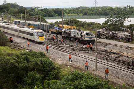 Electrical Train EG 9247 drive passes the Batu Gajah Train Accident, the worst train crash of Malaysia on 28th Oct 2016 in Perak, Malaysiaのeditorial素材