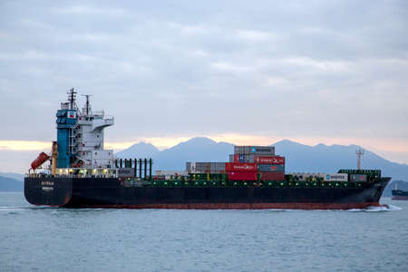 A cargo ship navigates on the sea near Hong Kongのeditorial素材